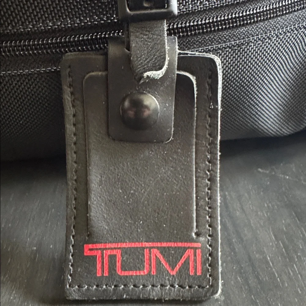 Tumi Black Men's Duffel with Red Logo Luggage Tag